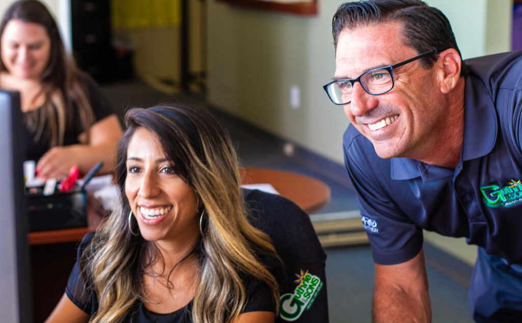 close up shot of guthrie team members smiling